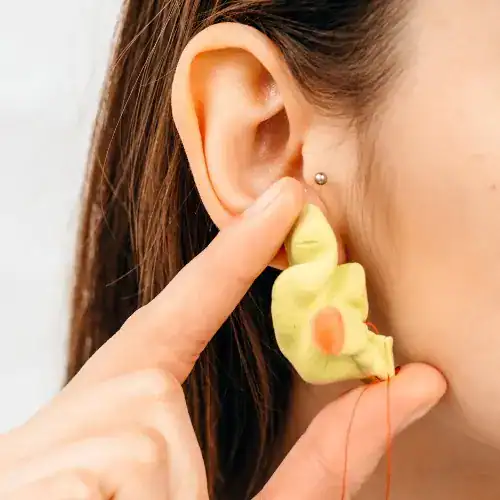Audiologist taking ear impression for custom earmold or hearing protection